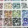 A grid of small glass crystal flatback rhinestones in various colors including gold, green, blue, and silver.