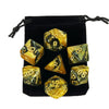 A set of polyhedral dice, including a d10 and d6, is displayed in a black storage bag.