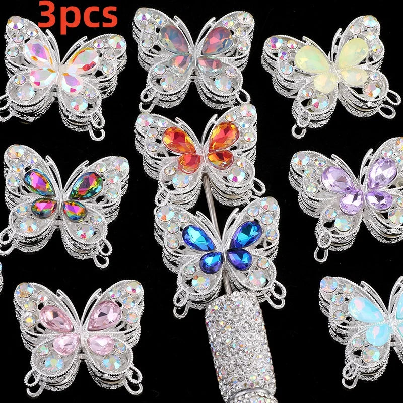 A collection of nine sparkling crystal butterfly beads in various colors and sizes for jewelry making