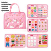 A pink toddler busy board with various sensory activities and colorful components for learning.
