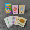 A set of colorful flash cards featuring food items like cake, milk, and hamburger for early learning.