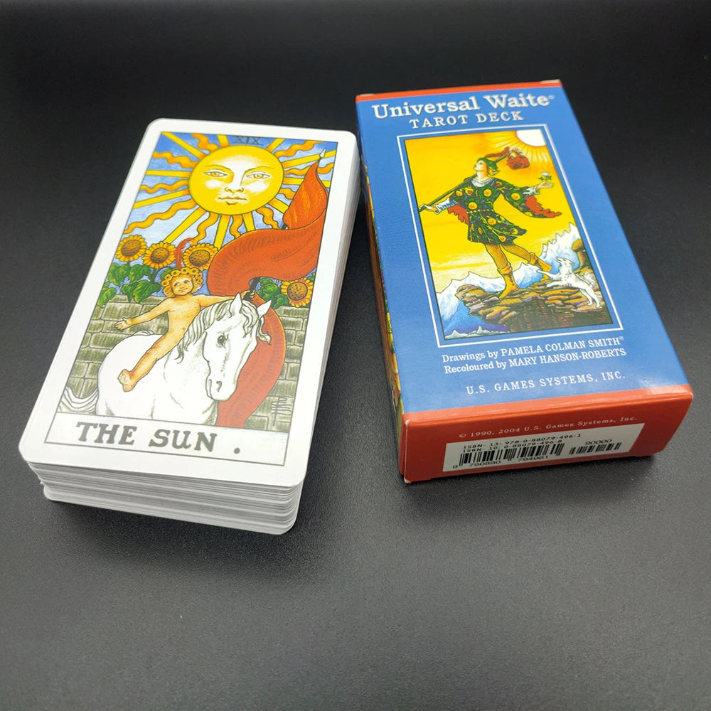 A box of the Universal Waite Tarot Deck with a colorful illustration of a figure on a yellow background.