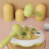 A green and yellow Montessori animal hammer toy is shown with several plastic animals on a round wooden base.