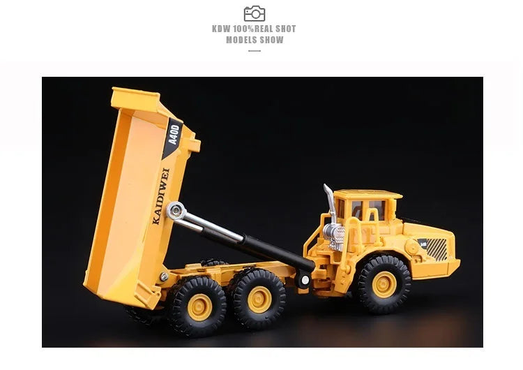 A yellow 1:87 scale articulated dumper truck diecast model with a raised hydraulic lift arm.