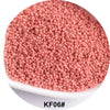 A pile of pink seed beads used for jewelry and craft, showing a close-up view.