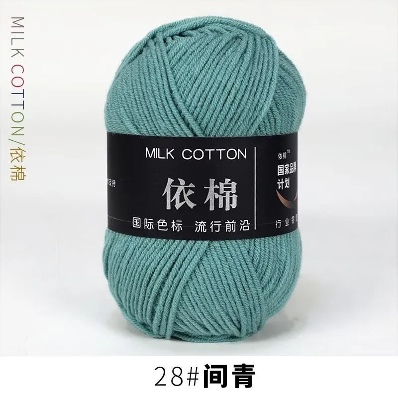 A ball of teal milk cotton yarn labeled with Chinese characters and the size 28#.