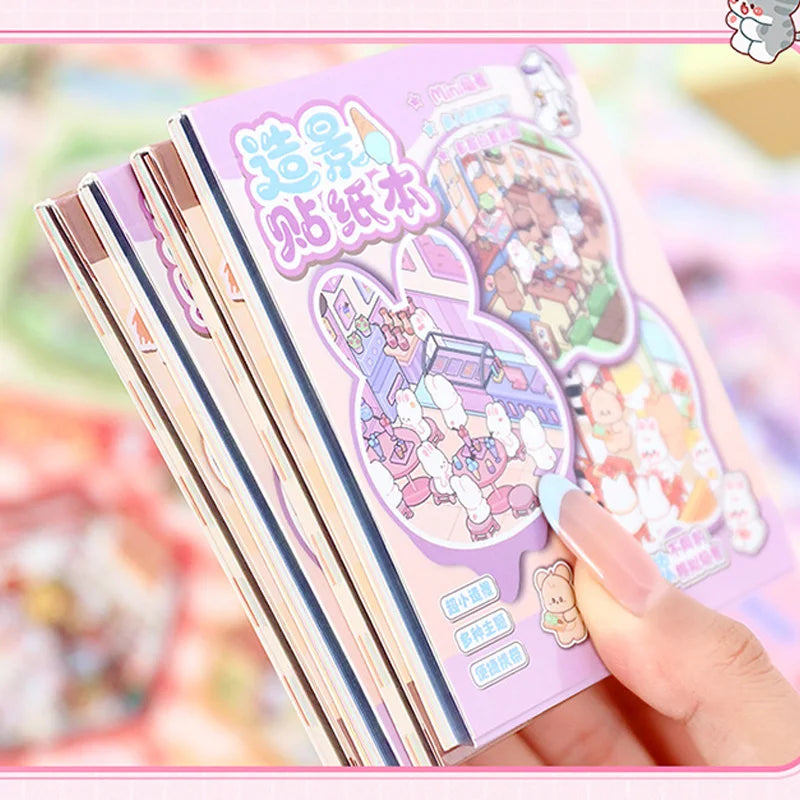 A hand holds a stack of 21-piece miniature cottage 3D sticker book for journaling and crafts featuring colorful illustrations