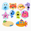 A collection of glow-in-the-dark animal washing water toys including a blue fish, a yellow crab, and a pink octopus.