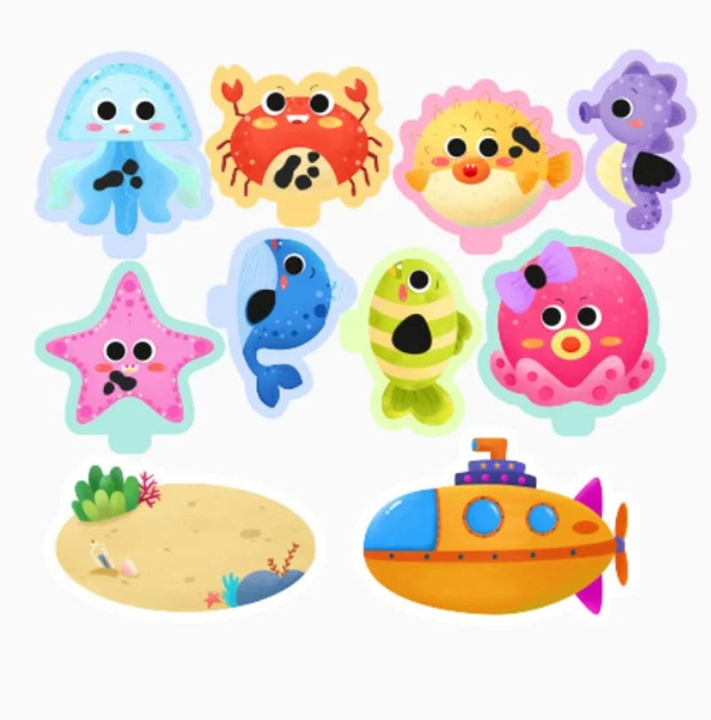 A collection of glow-in-the-dark animal washing water toys including a blue fish, a yellow crab, and a pink octopus.