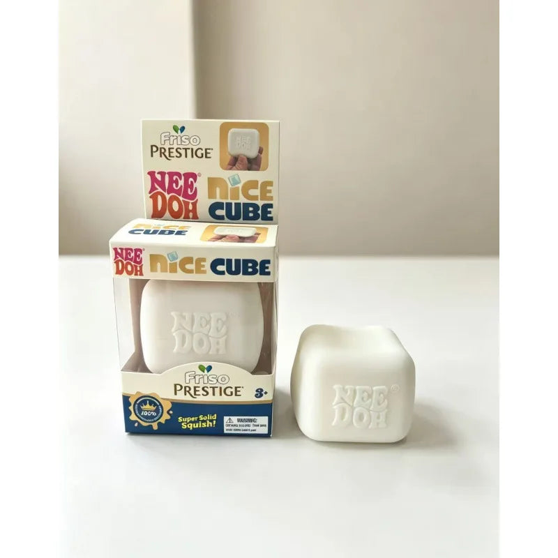A box and a white squishy fidget toy of the Needoh brand are shown on a white surface.