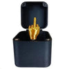 A black pop-up gift box with a gold middle finger hand visible inside.