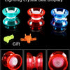 A display of four glowing crystal balls in various colors, including green, red, blue, and pink.