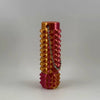 A vibrant orange and pink spike roller fidget toy with a silver keychain attached.