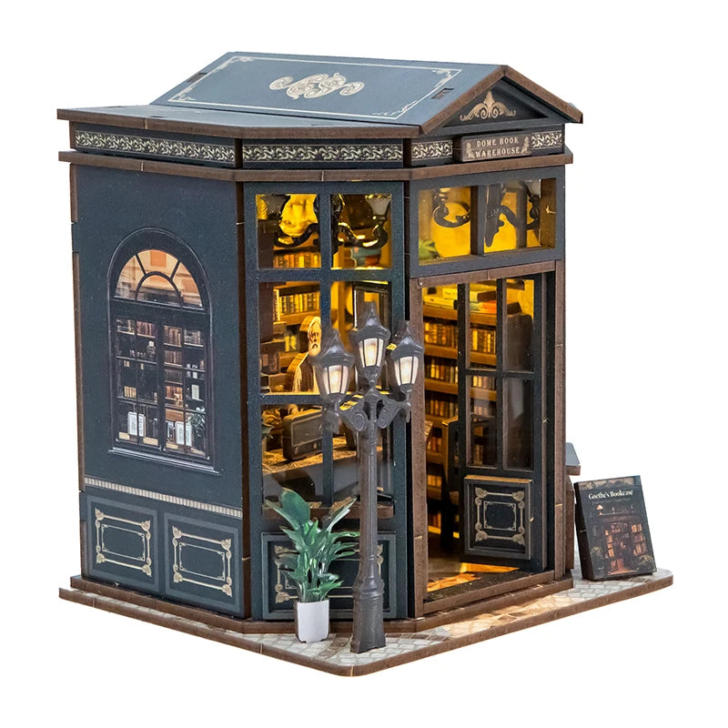A miniature DIY bookstore book nook kit featuring a detailed facade with illuminated bookshelves and architectural elements.