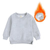 A light gray kids pullover hoodie is shown with an orange flame graphic surrounding it.