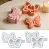 Pink silicone resin mold shaped like a bowknot with a pearl border and a butterfly shape in translucent silicone