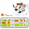 A model of a flying bison built from small plastic blocks with green, orange, and white colors.