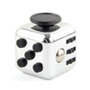 Silver fidget cube with black buttons and a round top