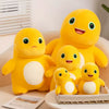 A yellow Kawaii Milk Dragon plush toy sitting on a white surface next to a small stuffed animal.