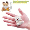 A small, light brown plush toy is shown next to a hand for scale, with a note about measurement error.