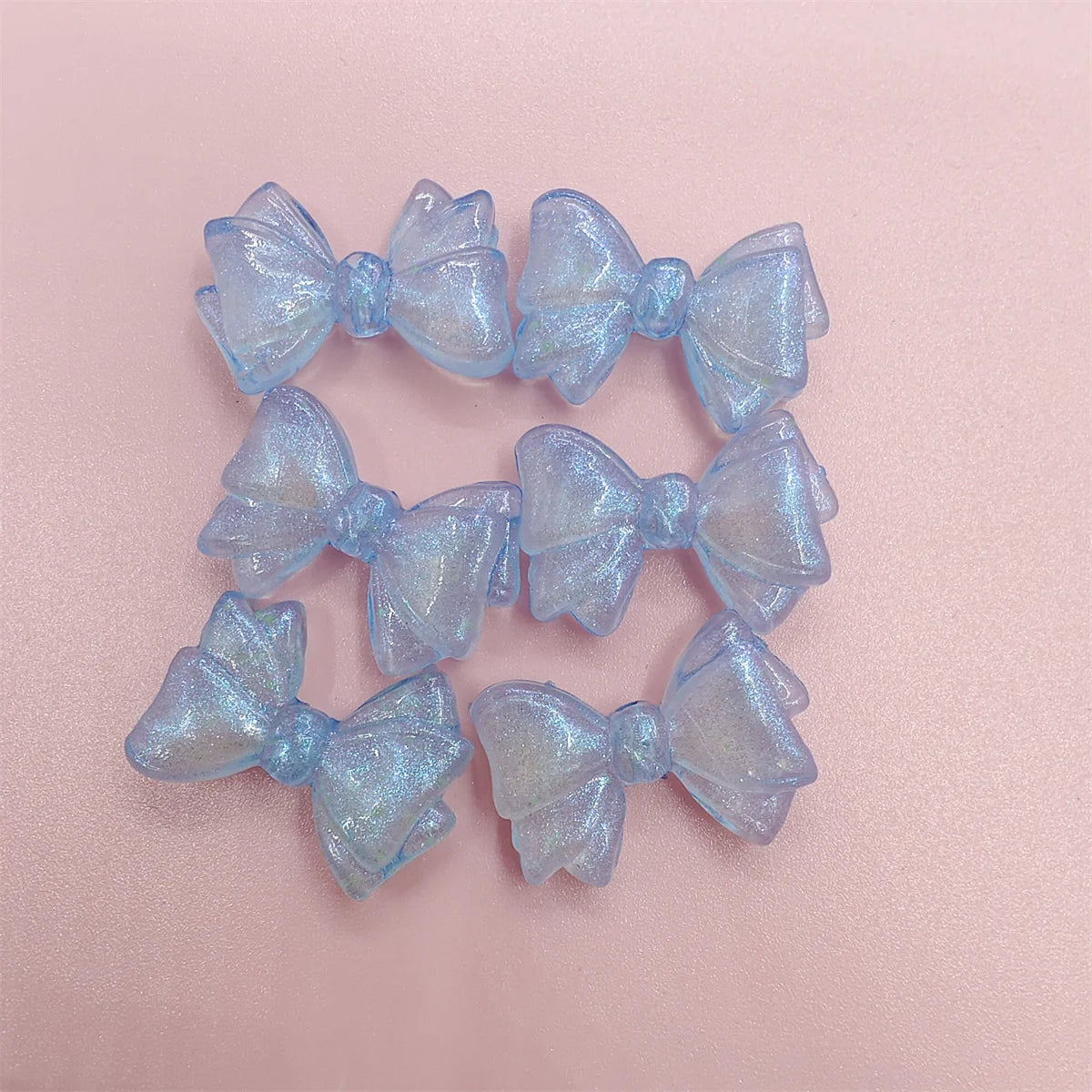 A set of shimmering light blue mermaid-themed bowknot beads for jewelry making