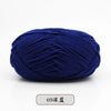 A ball of deep blue pre-dyed milk cotton yarn used for knitting and crochet.