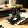 A green and black 1:64 scale RC Jeep Willys 4WD off-road crawler is shown on a wooden desk surface.