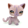 A pink Littlest Pet Shop style cat figure with purple accents and large eyes.