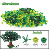 A set of green and black building blocks shaped like a cherry blossom tree, including seven units.