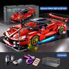 A red die-cast model of a sports car built from plastic building blocks displayed on a glass surface with accessories.