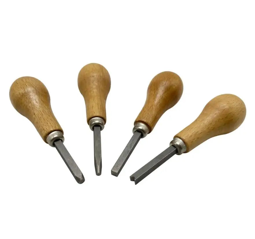 A set of professional bezel setting pusher tools with wooden handles and metal points.