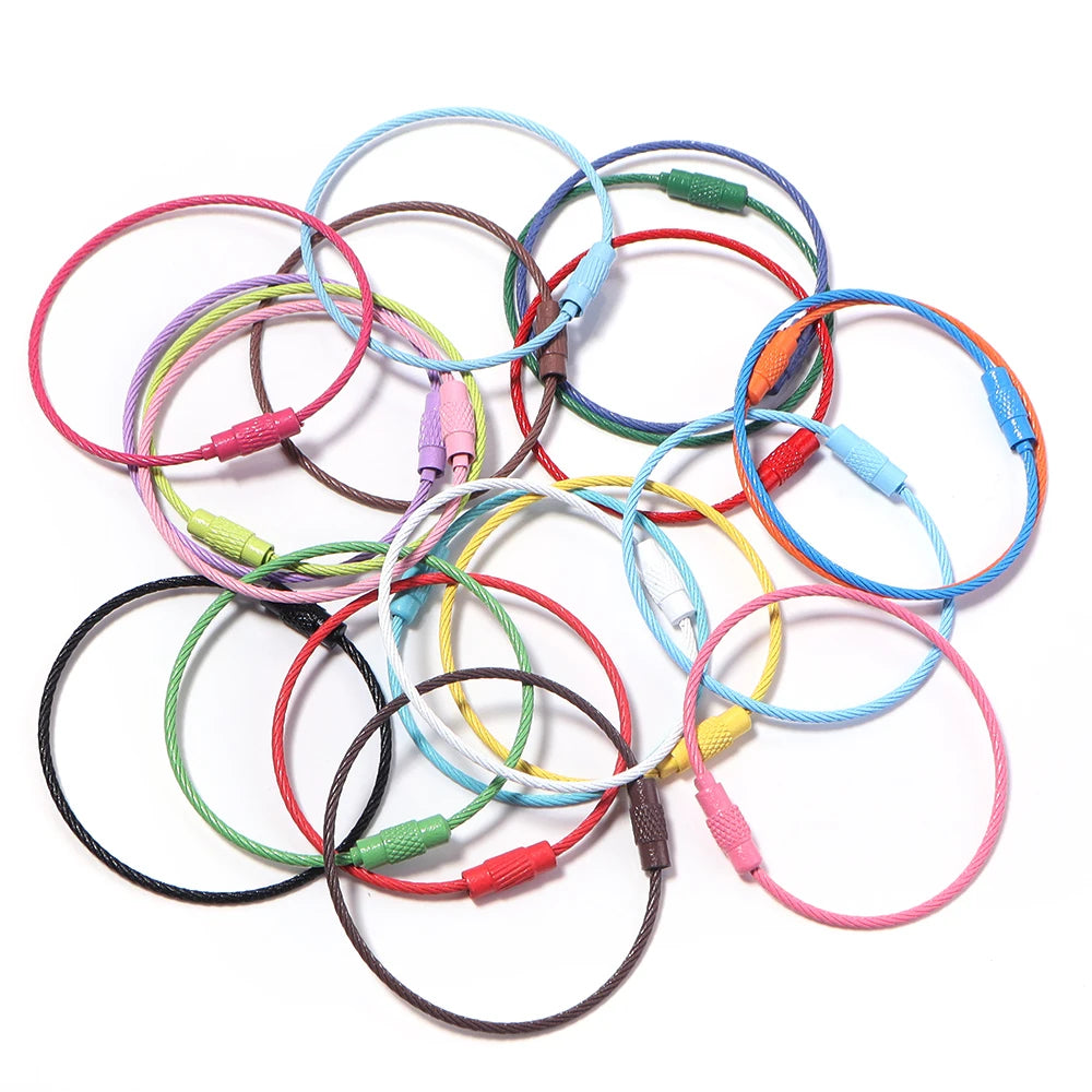 A collection of ten stainless steel wire keychain rings in various colors including red, blue, green, yellow, and pink.