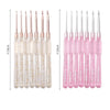 A set of seven pink and clear aluminum crochet hooks with color-coded handles shown against a white background.