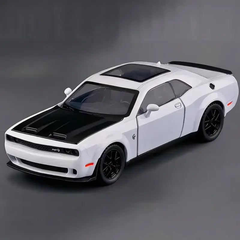 A white Dodge Challenger SRT Hellcat diecast model car with a black hood and roof, shown in a side profile.