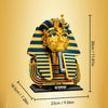 A detailed model of an Egyptian Pharaoh golden mask built from building blocks, featuring blue and yellow stripes.