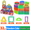 A collection of colorful magnetic building blocks in various shapes and sizes stacked in piles.