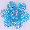 A cluster of bright blue and silver mixed two-tone striped resin beads for jewelry making
