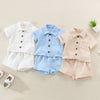 A set of baby boy cotton linen summer shirt and shorts in white, light blue, and beige tones.