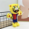 A yellow and orange football mascot cat plush toy standing in front of a light background.