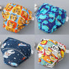 A set of four reusable cotton potty training pants for toddlers in various colorful patterns.