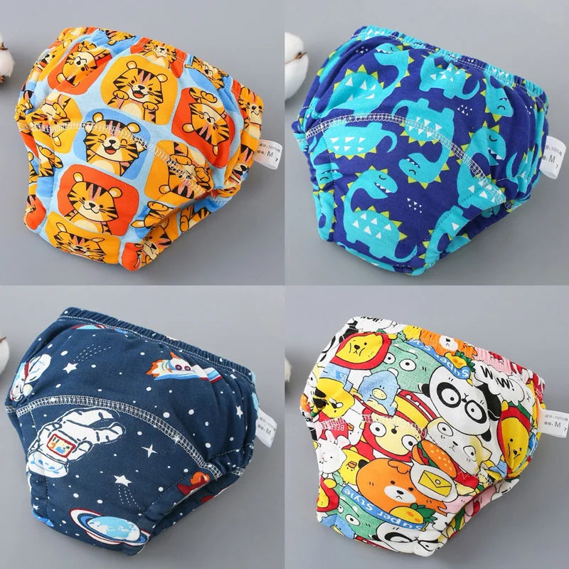 A set of four reusable cotton potty training pants for toddlers in various colorful patterns.