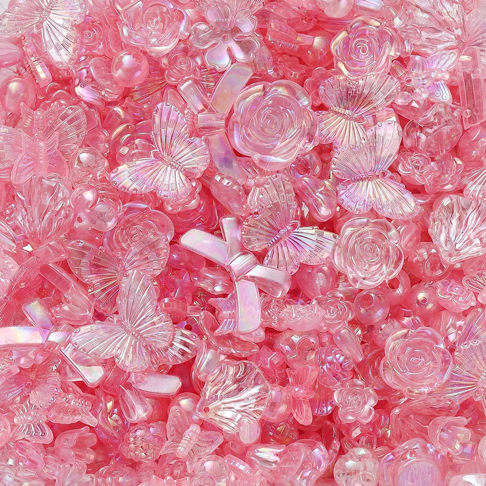 Close-up of pink and iridescent acrylic butterfly shell beads for DIY jewelry making