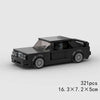A black classic rally car building block set with clear windows and detailed exterior features.