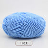 A ball of light blue pre-dyed milk cotton yarn used for knitting and crochet.