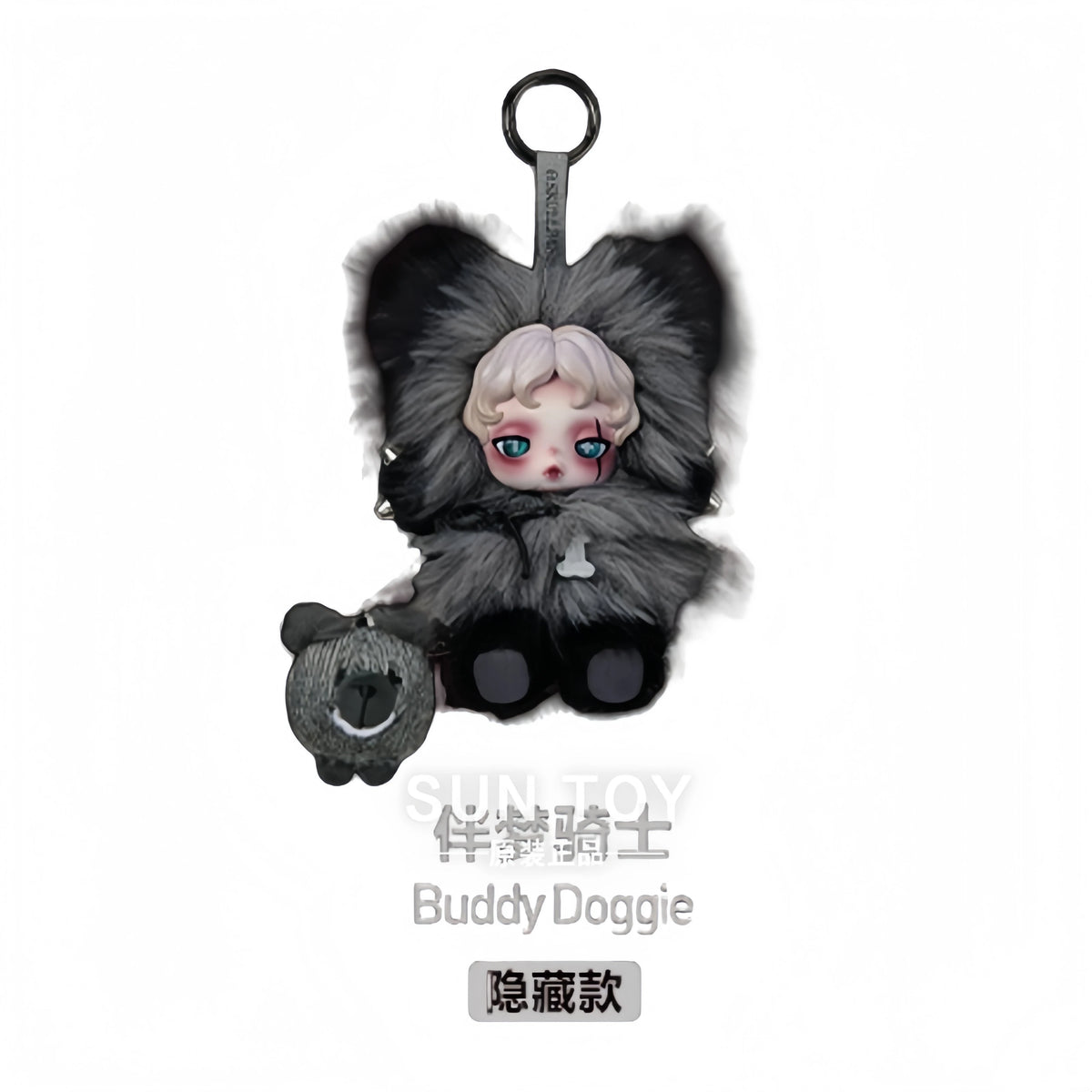 A collectible figure of a small, pale-skinned creature with large blue eyes, surrounded by dark gray and black fluffy fur.