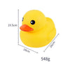 A yellow rubber duck toy with an orange beak and black eyes, shown with dimension lines.