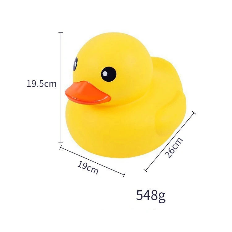A yellow rubber duck toy with an orange beak and black eyes, shown with dimension lines.