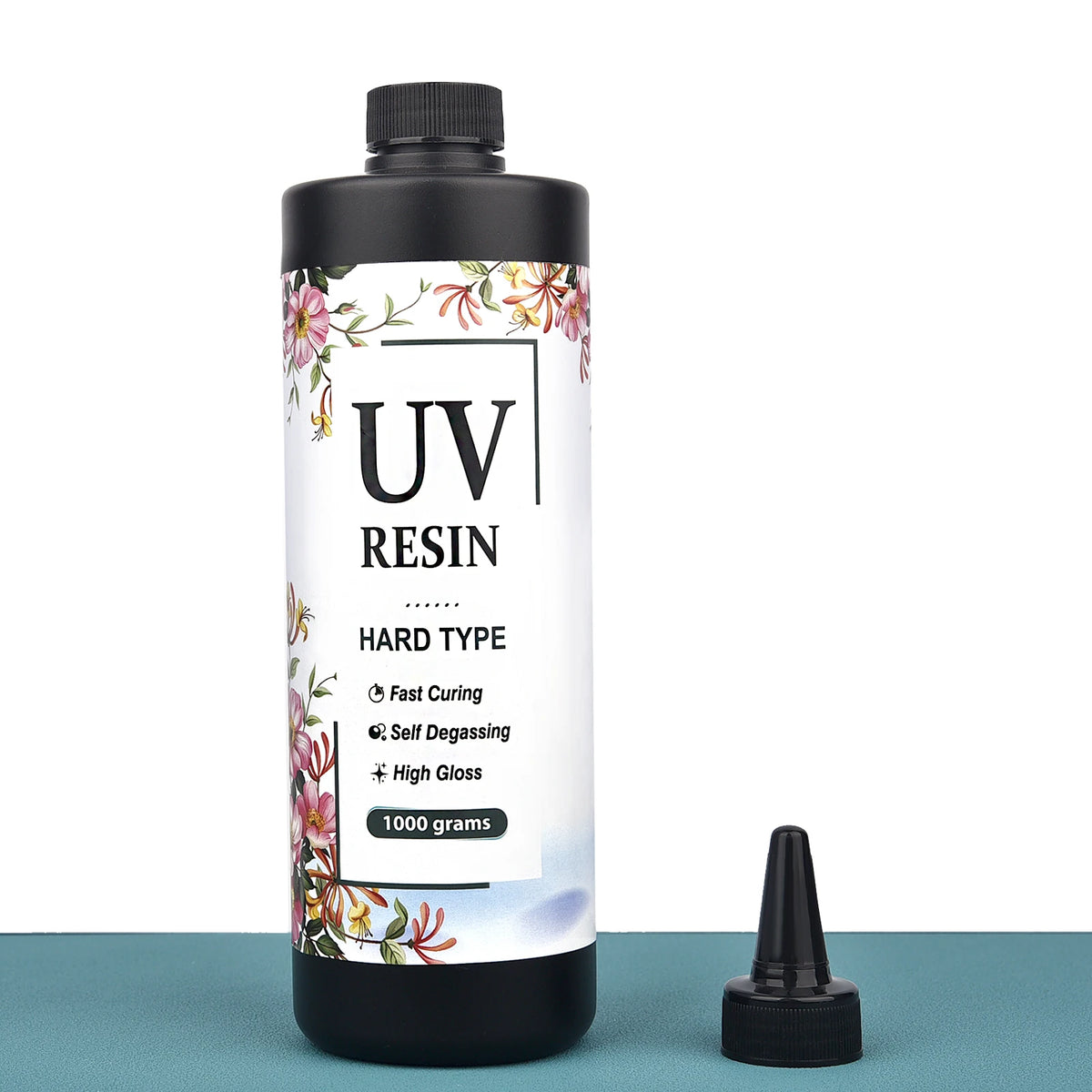 A bottle of UV resin hard type clear glue for jewelry making and crafts with a black cap.