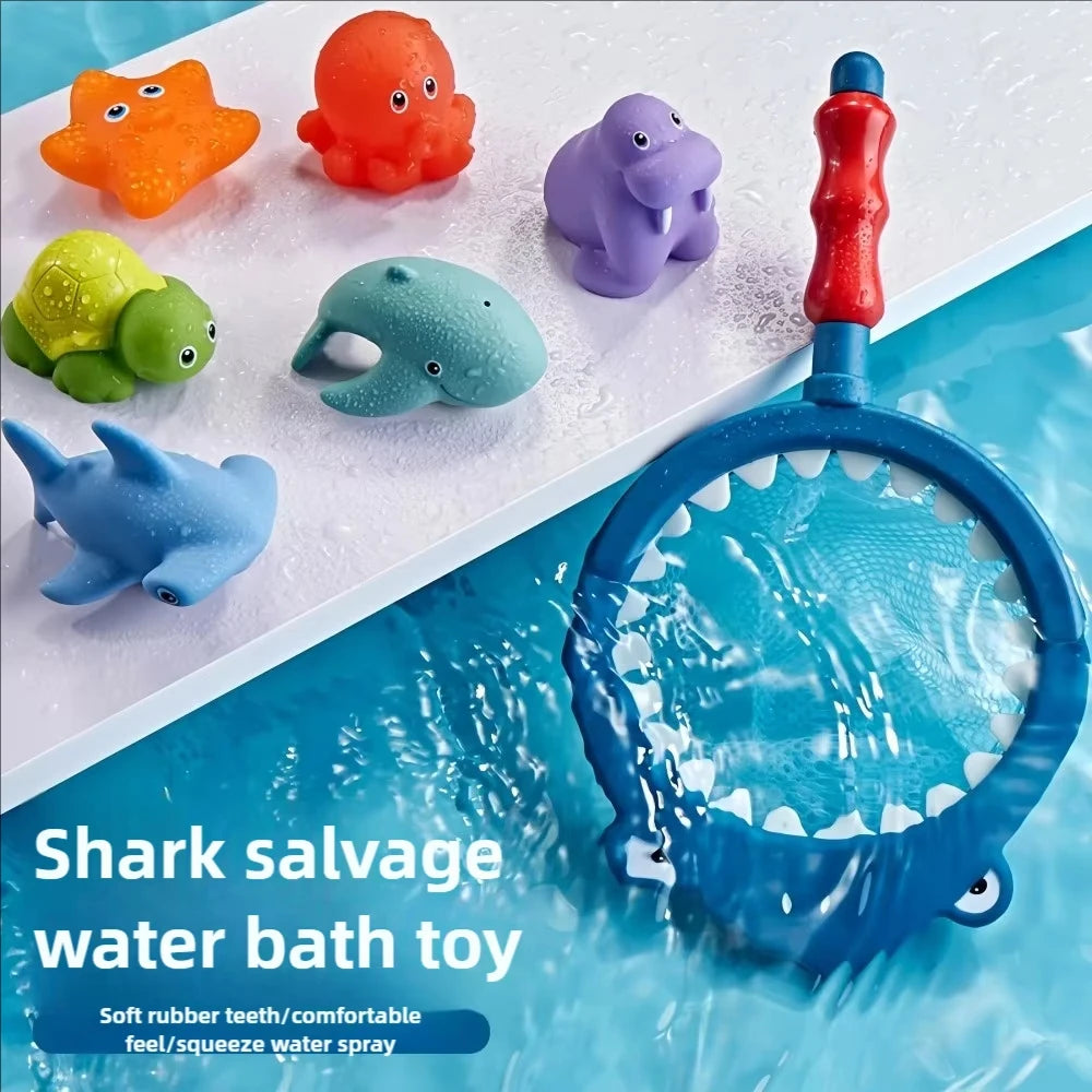A collection of colorful bath toys including an orange frog, red duck, purple elephant, green turtle, and a blue shark salvag