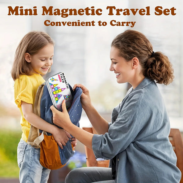 A woman is showing a child how to use a mini magnetic travel set for building blocks.